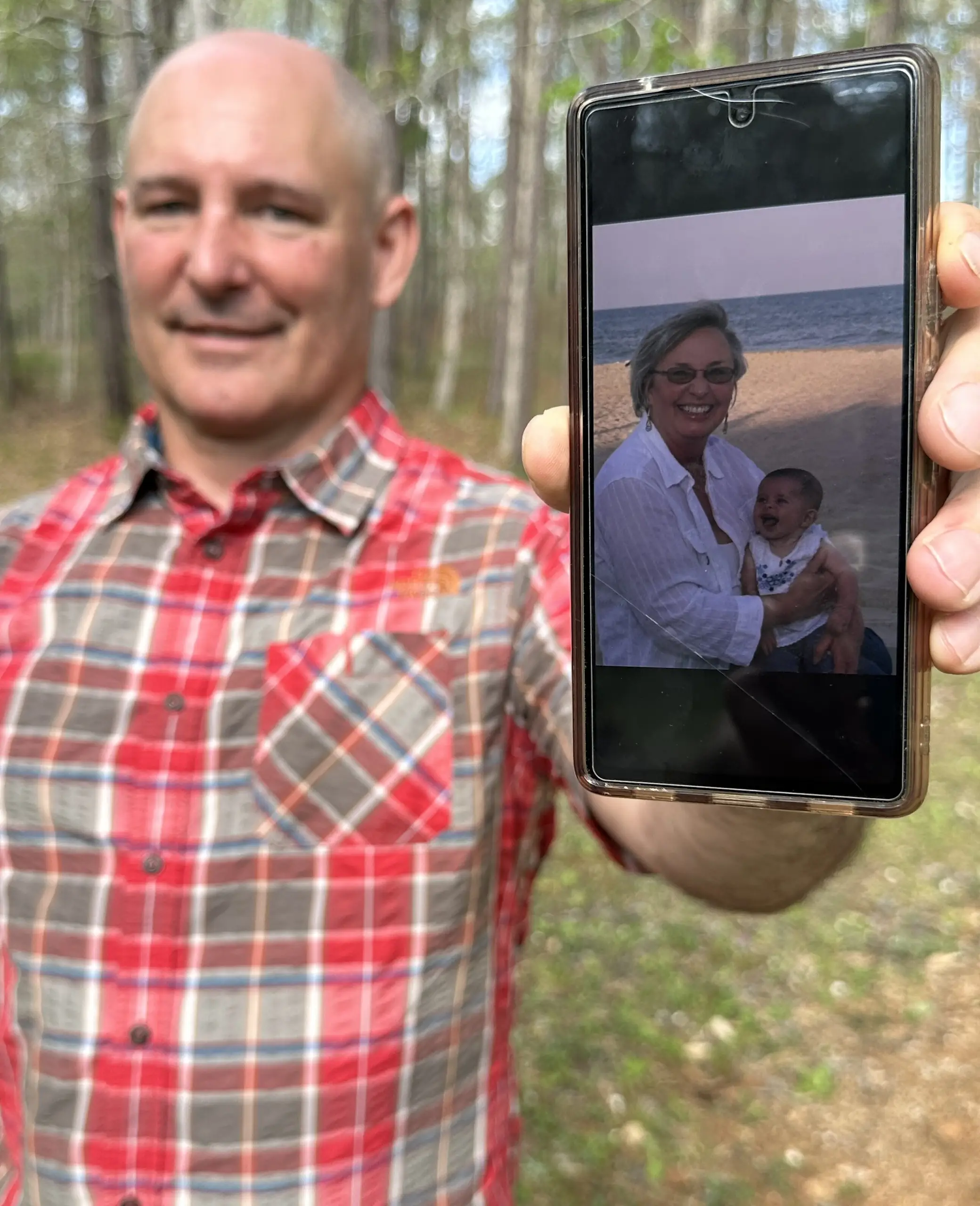Martin shows photographs of his mom while visting Whispering Hills on her birthday in April
